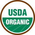 USDA Certified Organic Logo - White circle with brown outline and green and white sans-serif type inside with green illustrated crop field