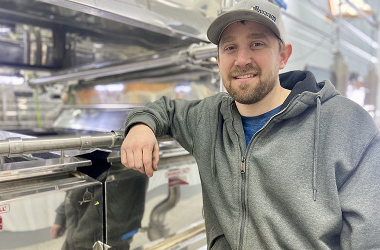 Photo of Evan Branon in the sugarhouse