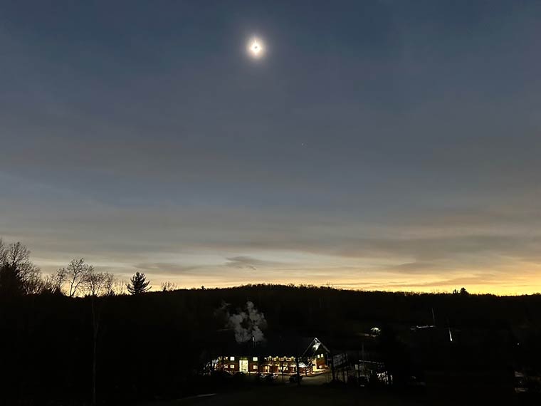 Photo of solar eclipse above sugar house