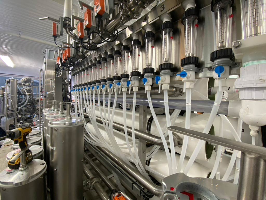 This photo shows a reverse osmosis machine, a modern-day piece of equipment with tubes