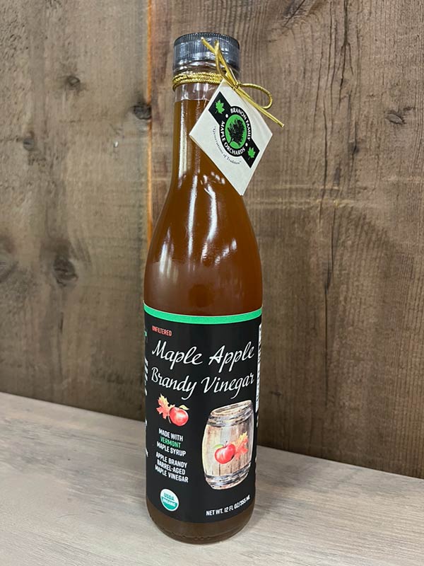 Photo of Organic Maple Apple Brandy Vinegar on wooden shelf