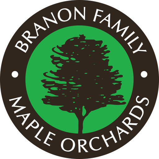 Branon Family Maple Orchards Icon - White sans-serif type inside black circle with tree and green background